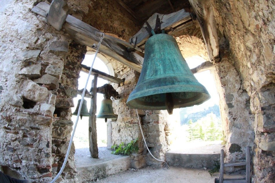 Bell in the stone tower of the church