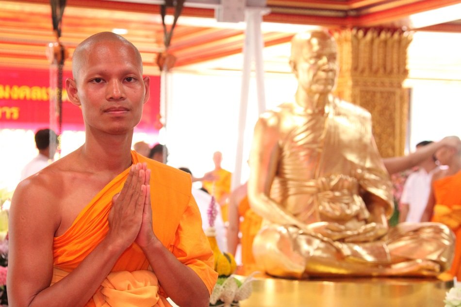 buddhist near the buddha statue