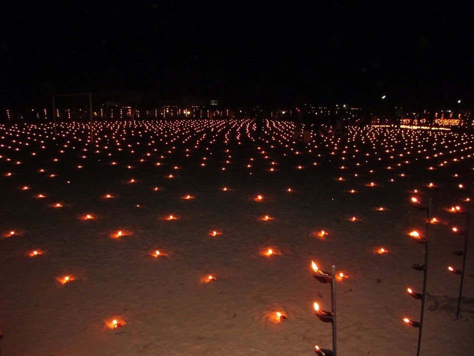 burning oil lamps near the temple