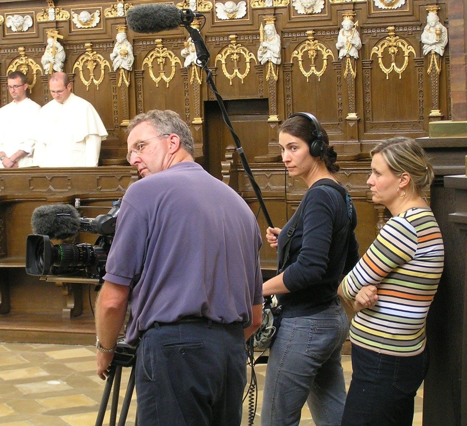 tv crew at work in church interior