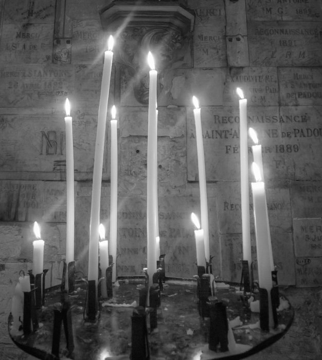 black and white picture of church candles