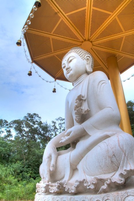 buddha statues under the umbrella