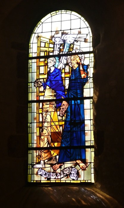 Church window with stained glass in Mont Saint-Michel, France