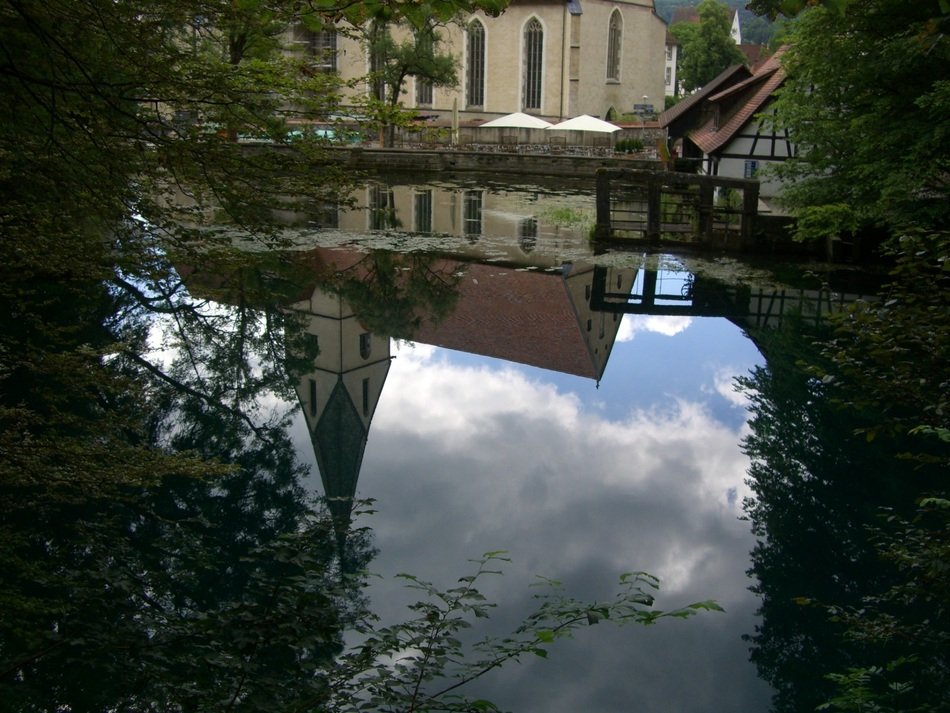 mirror image of the monastery in the water, germany, blaubeuren
