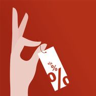 Hand holding price tag