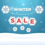 suspended origami paper with the inscription sale and snowflake