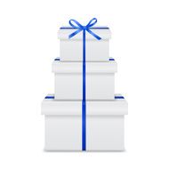 Stack of white gift boxes with blue ribbon and bow