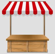 store window with striped awning