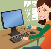 Girl using payment card online with computer