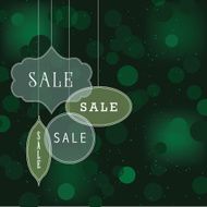 Sale ornaments on green bokeh background
