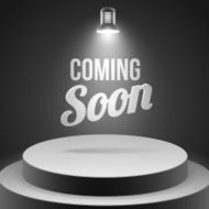 Coming soon message illuminated with stage light
