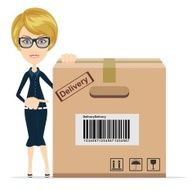 Business woman pointing to a large cardboard box