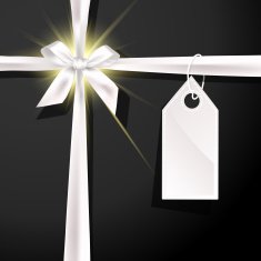 White gift bow with label on black background N2