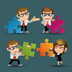 Team of business people collaborate holding up jigsaw puzzle pieces