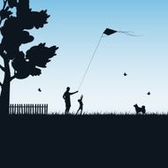 Father and child play with kite N2