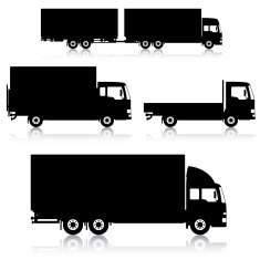 silhouetted commercial trucks