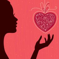 Beautiful woman silhouette with floral heart