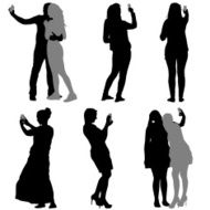 Silhouettes man and woman taking selfie with smartphone