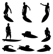 Surfer dudes hanging ten and surfing
