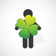 black silhouette of a man holds the four-leaf clover