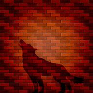 Shadow of wolf on a brick wall