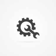 Wrench and cogwheel icon isolated on white