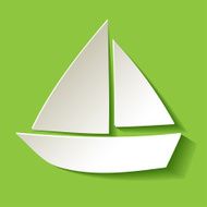 Paper sailboat white on a green background