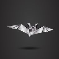 metal chrome origami bat on a black background N2