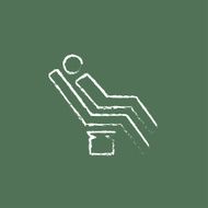 Man sitting on a dental chair icon drawn in chalk