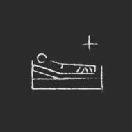 Patient lying on the bed icon drawn in chalk N2
