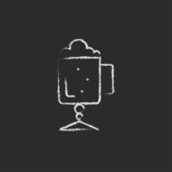 Glass mug with foam icon drawn in chalk