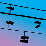 Shoes Hanging on Telephone Wire Silhouettes