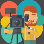 Cameraman and his video cam with stand