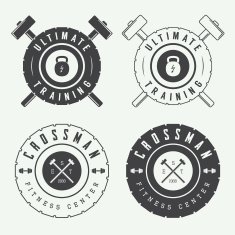 Set of gym logos labels and slogans in vintage style