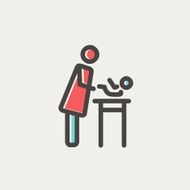 Woman changing the baby diaper thin line icon