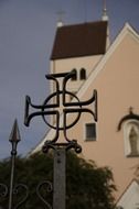 cross on the background of the monastery