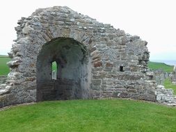 ruins of Viking church among the field in Scotland