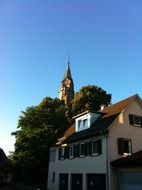 spire of the church between the trees in schwÃ¤bisch hall