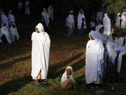 parishioners in white clothes in the ethiopian orthodox church