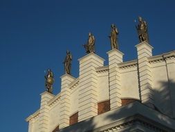Bronze statues on a high building in Kutaisi