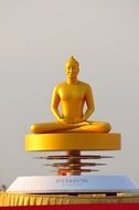 golden statuette buddha
