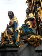 sitting men statues, detail of Schoener Brunnen, germany, nuremberg