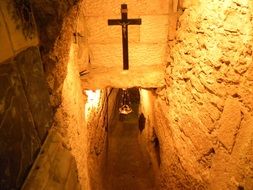 crucifixion at ceiling in narrow passage