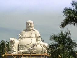 happy buddha, white statue at top of Vinh Trang Pagoda, vietnam