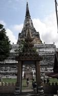 People at the entrance to the Buddhist temple in Thailand