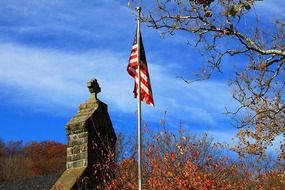 stone Church tower and flag of America