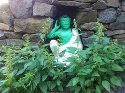 Statue of Buddha in the grass