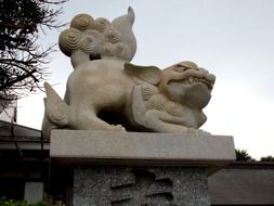 stone guardian dogs near the temple in japan