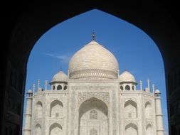 view of the Taj Mahal through the arch
