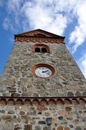 Church tower with stone clock